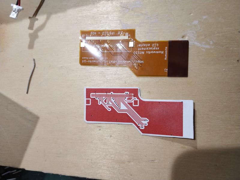 Flex-PCB adapter side-to-side with the paper print.